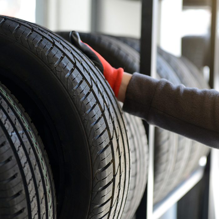 someone inspecting a tire